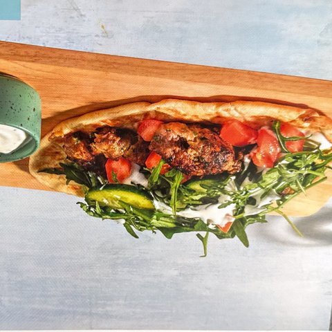 Kofta Skewers on Warm Naan with Yoghurt Sauce and Side Salad